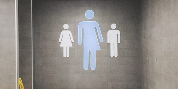 Transgender bathroom design image; half man and half woman joined to make a transgender bathroom logo sign; LEED exam prep; LEED CE; WELL exam prep; well study tools; WELL AP; LEED study tools